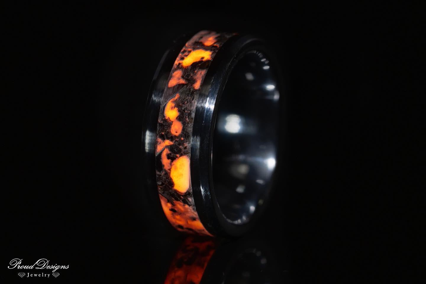 Ring with a glowing orange inlay, handmade by Proud Designs Jewelry