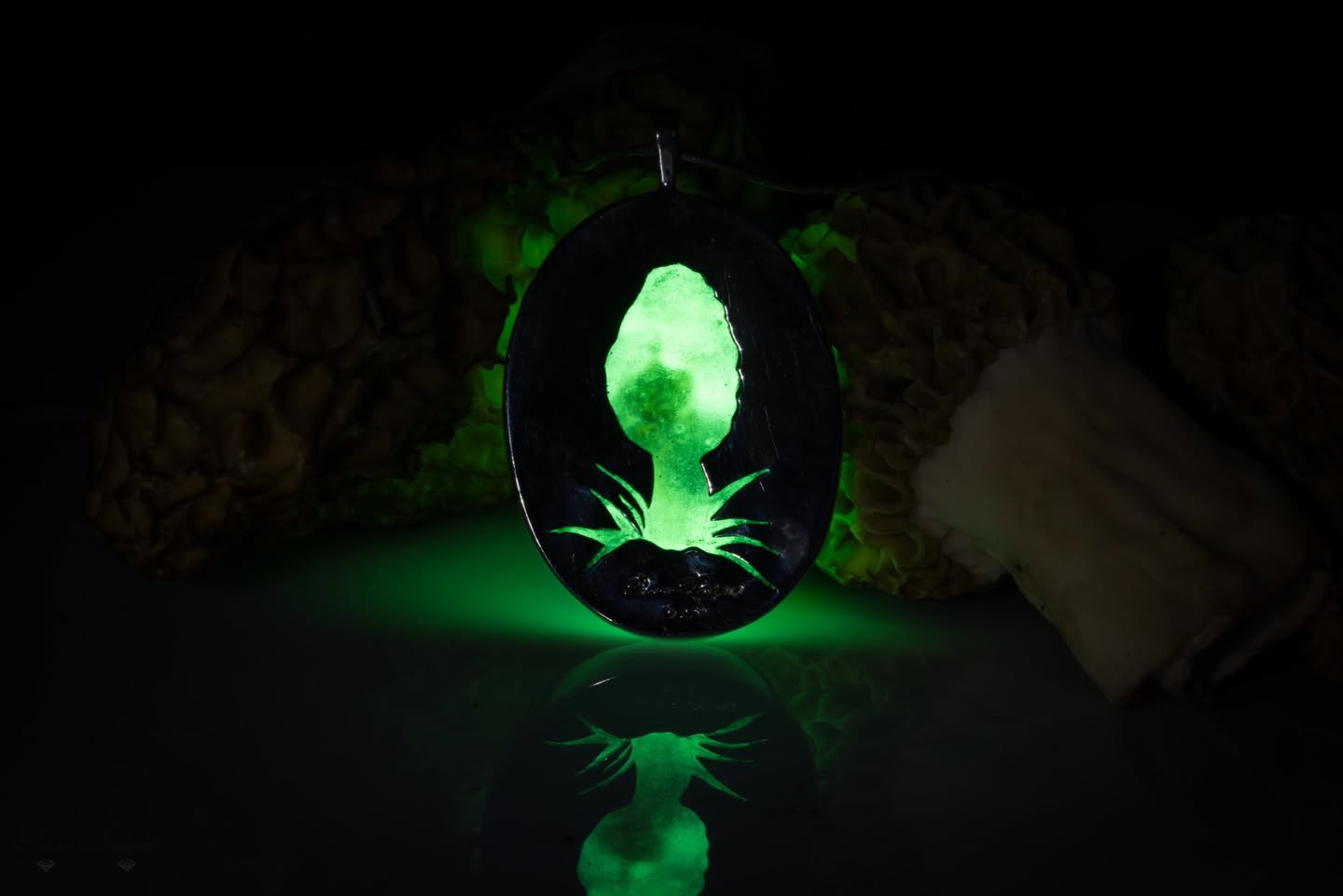 Ring with a glowing green stone, handmade by Proud Designs Jewelry